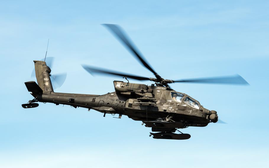 A U.S. Army AH-64 Apache attack helicopter flies over Joint Base Elmendorf-Richardson, Alaska, July 29, 2022.