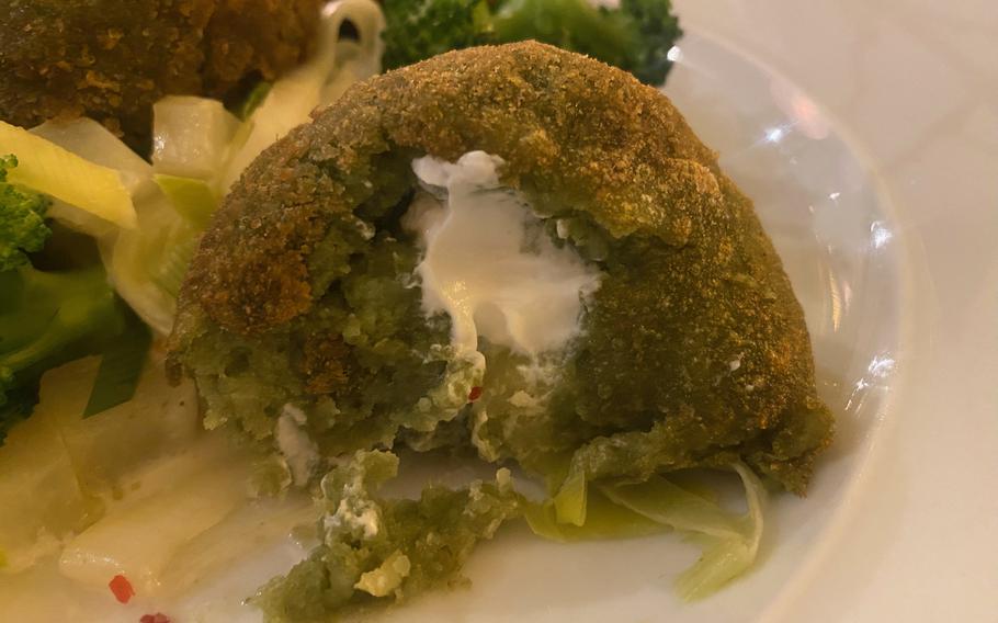 One of Oelmuehle's vegetarian offerings is spinach and potato dumplings, which have a goat cheese filling and are served with fresh vegetables.
