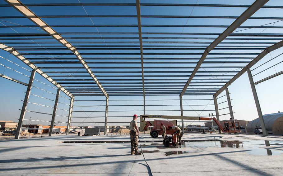 Airmen from the 557th “Red Horse” squadron build a structure at Al Udeid Air Base, Qatar, in 2017. The unit held a deactivation ceremony at the base on Oct. 15, 2022.