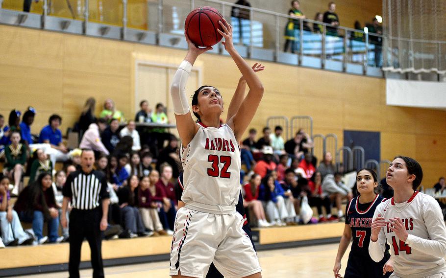 Kaiserslautern senior Emma Arambula grabs an offensive rebound during pool-play action of the DODEA European basketball championships against Lakenheath on Feb.14, 2024, at the Wiesbaden Sports and Fitness Center on Clay Kaserne in Wiesbaden, Germany.