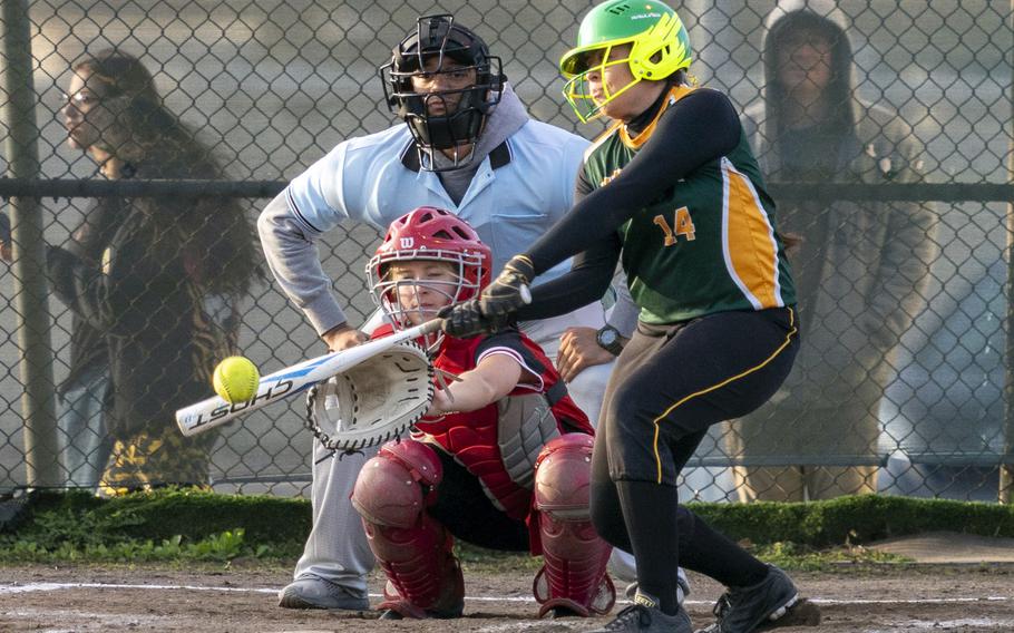 Robert D. Edgren's Teniya Nelson belts the ball against Nile C. Kinnick during Friday's DODEA-Japan softball game. The Eagles won 26-3.