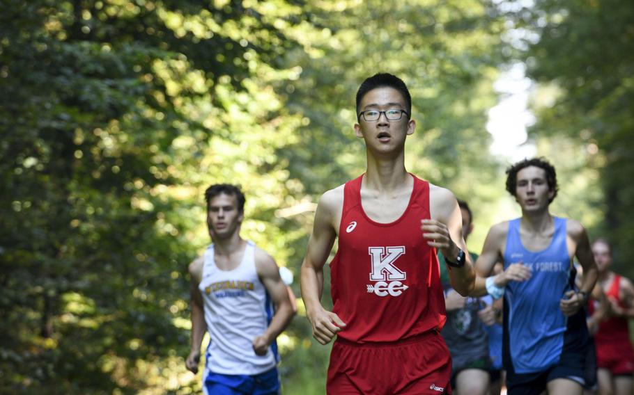 Daniel Lee, a runner at Kaiserslautern, paces himself during the beginning of a high school boys’ varsity cross country race Saturday, Sept. 18, 2021, in Kaiserslautern, Germany.