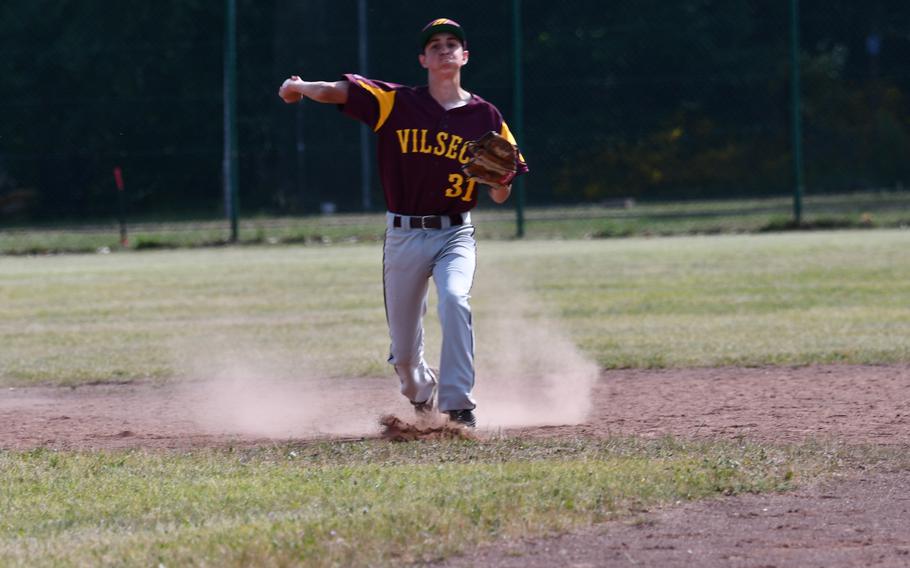 Vilseck shortstop Michael VanGilder fields a ground ball and throws to first during the team’s opening game of the tournament at the 2022 DODEA-Europe baseball championships.