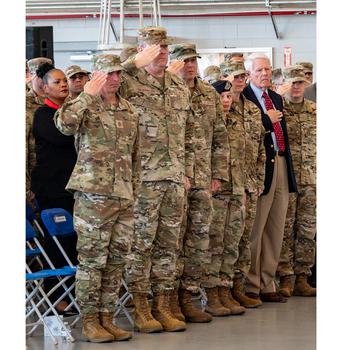Chief Master Sergeant of the Air Force David Flossi and Lt. Gen. Tony Bauernfeind, Air Force Special Operations commander, salute during the playing of the national anthem at Senior Airman Roger Fortson’s memorial service at Hurlburt Field, Fla., May 20, 2024. 