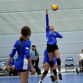 Rota's Zoey Lee, right, goes up for the ball as Jourdan Timmons watches during pool play of the DODEA European volleyball championships on Thursday at Ramstein High School at Ramstein Air Base, Germany.

Matt Wagner/Stars and Stripes