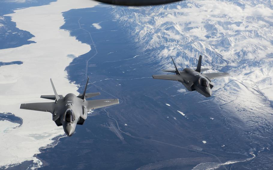 Two F-35A Lightning II aircraft fly over the Alaska Canada Highway in April 2020, en route to their new home at the 354th Fighter Wing, Eielson Air Force Base, Alaska.