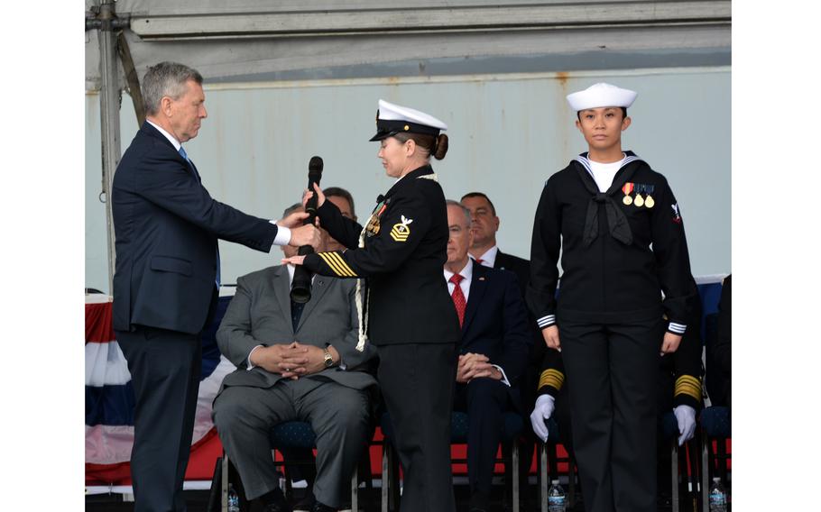 The long glass is passed to the Chief Petty Officer of the Watch, setting the first watch of USS John. L. Canley during the ship’s Commissioning Ceremony, Feb. 17, 2024, at Naval Air Station North Island, Calif.