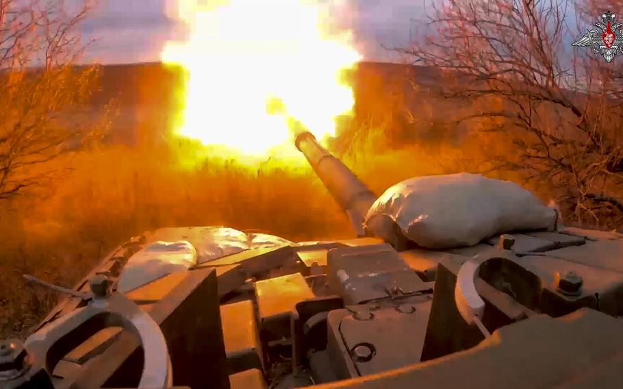 In this photo released by the Russian Defense Ministry on March 19, 2024, a Russian tank fires at Ukrainian troops from a position near the border with Ukraine in Russia’s Belgorod region. 