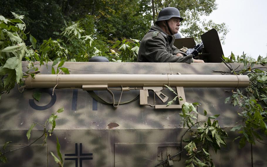 Reenactors portraying Germans during a battle at the Rockford World War II Days event on Sept. 24, 2022, in Rockford, Ill. 