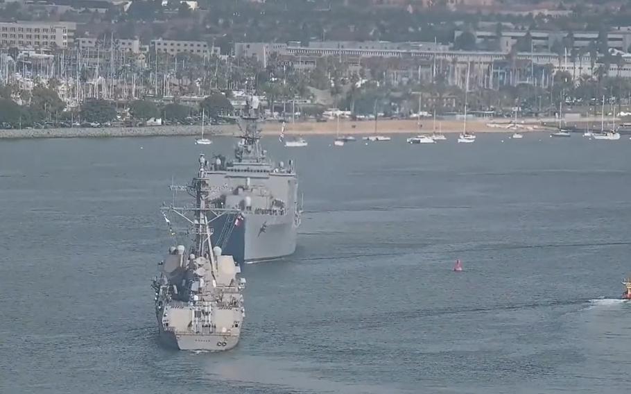 The USS Momsen, a guided-missile destroyer, and USS Harpers Ferry, a dock-landing ship, were moving in opposite directions in San Diego Bay on Tuesday, Nov. 29, 2022, when they came close to colliding, service officials said. 