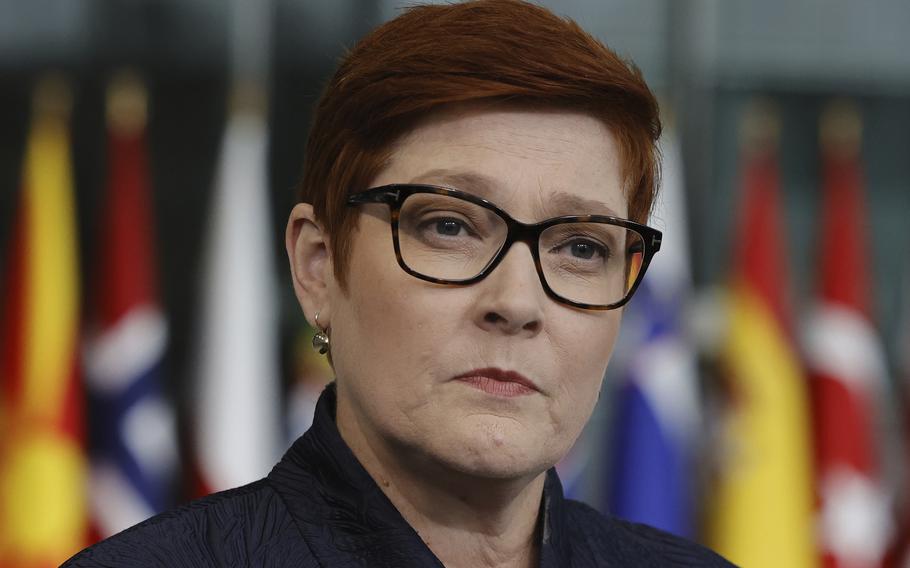 Australian Foreign Minister Marise Payne speaks with the media as she arrives for a meeting of NATO foreign ministers at NATO headquarters in Brussels on April 7, 2022. Payne said on Saturday, May 7, 2022 she met the Solomon Islands’ Development Planning and Aid Coordination Minister Jeremiah Manele in the Australian east coast city of Brisbane as he transited through the airport on Friday night. 