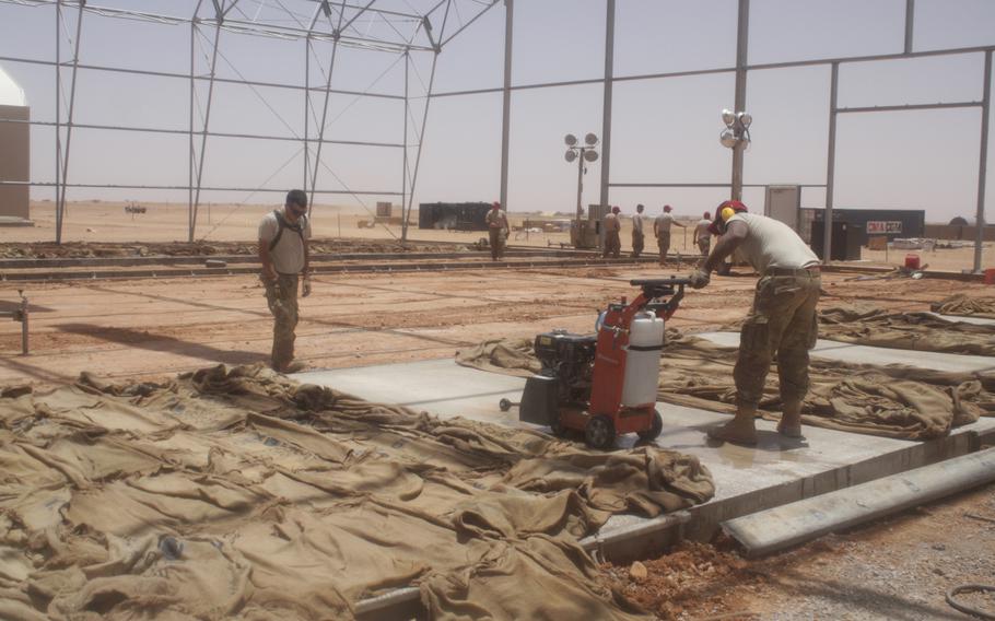 Airmen work in what would become the unmanned aircraft apron at Air Base 201, in Agadez, Niger, in 2018. The area where drones would be parked when they were not in operation was part of an Air Force project that was touted as the largest airman-led construction effort in history. 