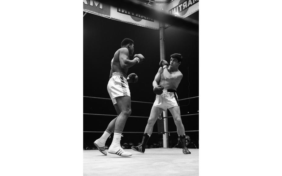 Muhammad Ali's famously fast feet take flight as he takes on German boxer Karl Mildenberger in the ring at the Waldstadion in Frankfurt.