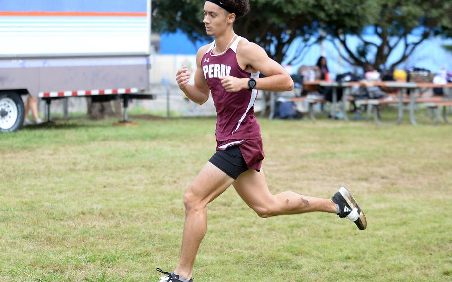 Matthew C. Perry junior Tyler Gaines heads for the finish line.