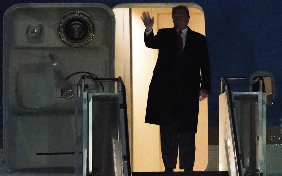 Then-President Donald Trump waves to onlookers as he exits Air Force One at the Toledo Express Airport in 2020. Trump won't be at Munich's annual security conference this weekend, but what his possible second term as president would mean for European security is expected to be discussed.
