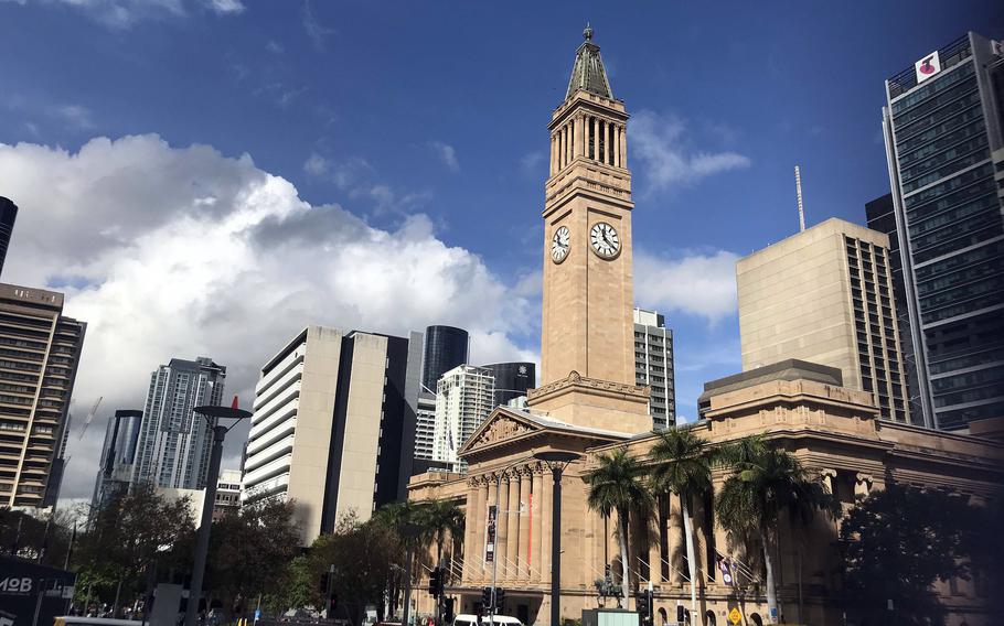 A city hall building in Brisbane has a tall clock tower.