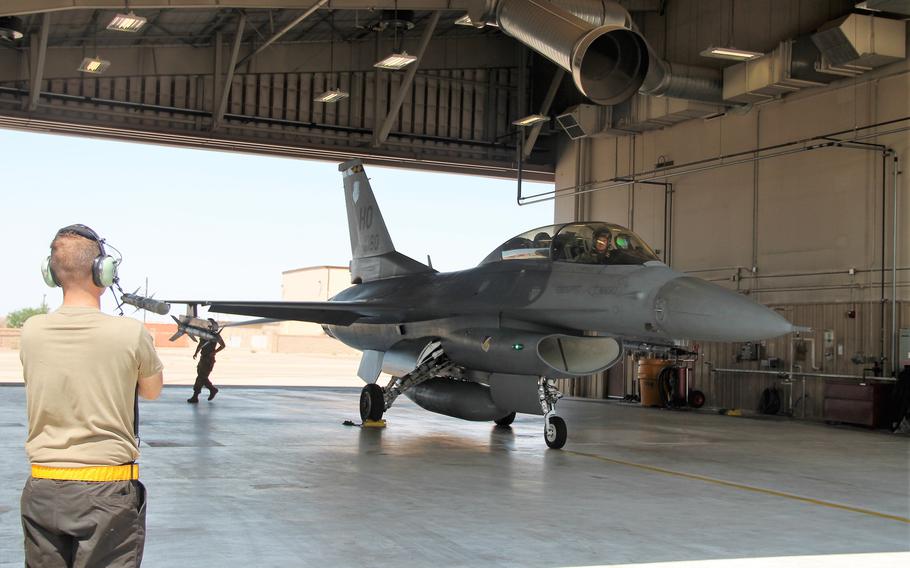A F-16 flight carrying pilot Capt. Patrick Mayfield of Holloman Air Force Base and his brother, NHL player Scott Mayfield, returns to a hangar on Holloman Air Force Base on Aug. 4, 2021.