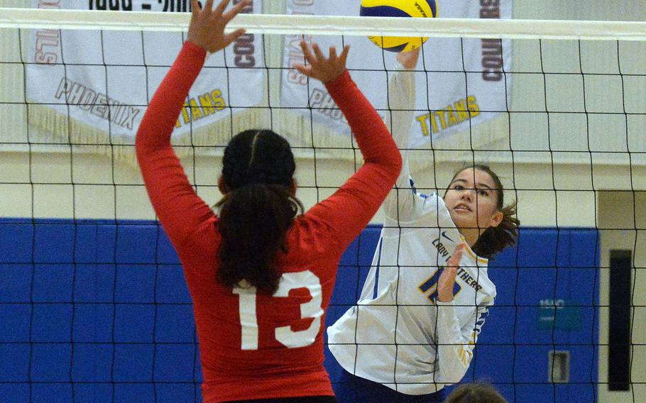 Yokota's Elena Haas spikes against Nile C. Kinnick's Cierra San Nicolas during Saturday's Japan girls volleyball match. The Red Devils won in straight sets.