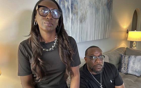 FILE - Trina Martin, left, and Toi Cliatt sit for a portrait inside the home the FBI mistakenly raided in 2017, in Atlanta, April 25, 2025. (AP Photo/Sudhin Thanawala)