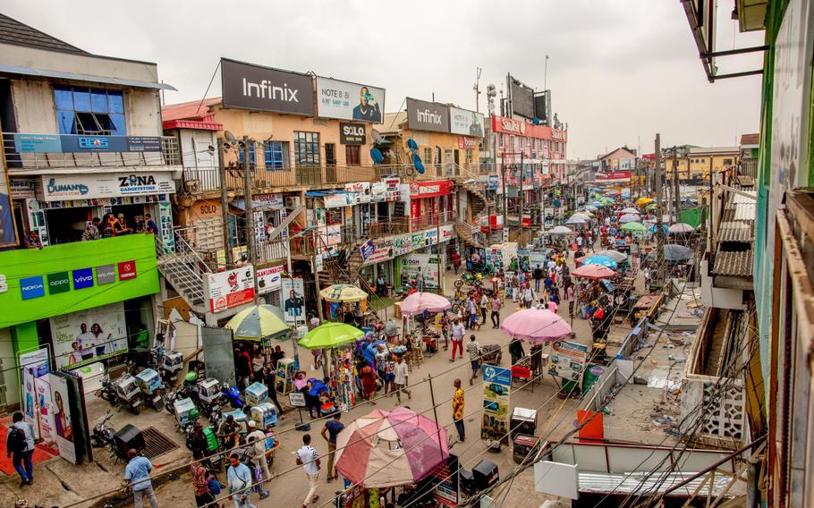 Crowds of shoppers walk through the Ikeja computer village market in Lagos, Nigeria, on March 29, 2021.