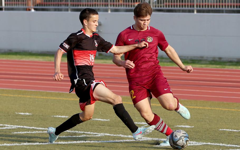 Noah Charles tries to get past Ben Duncanson.