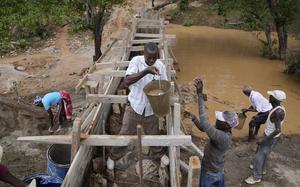Residents in Machakos County, Kenya, construct a sand dam on Feb. 29, 2024.