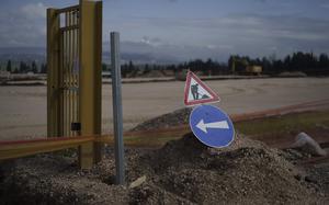 A sign is displayed at a construction site where houses will be built for displaced residents of Kibbutz Nahal Oz, at Kibbutz Mishmar HaEmek, northern Israel, Sunday, Feb. 4, 2024.