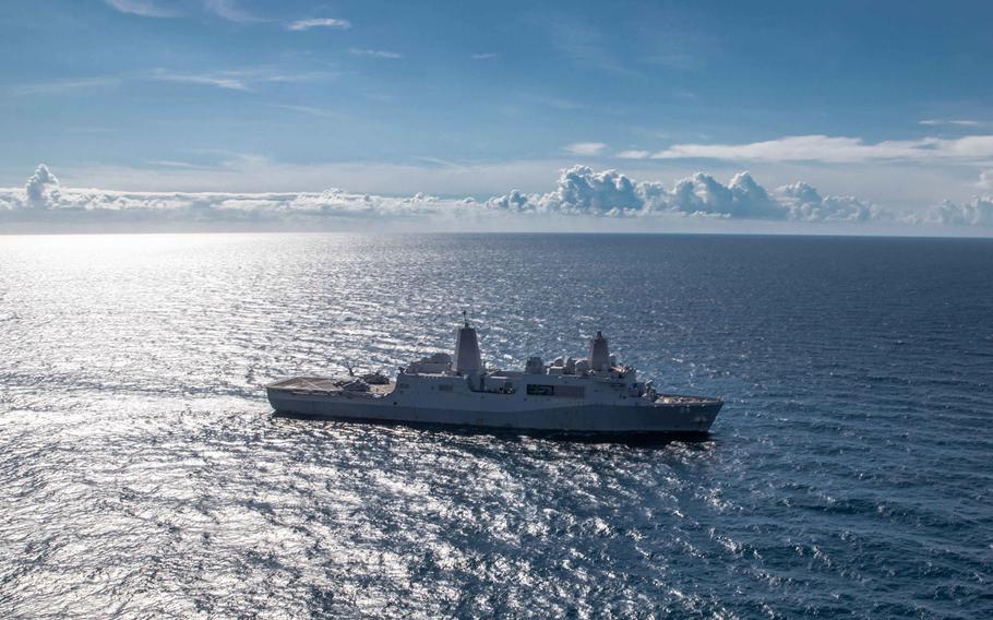 The USS Arlington sails in the Atlantic Ocean on Oct. 22, 2021. Over three months in early 2019, a Marine aboard the ship used a GoPro to film unsuspecting female crew members while they were undressed in a bathroom on the ship. 