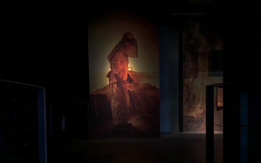 An image of an iron worker is projected onto the wall at Voelklingen Ironworks in Voelklingen, Germany. 