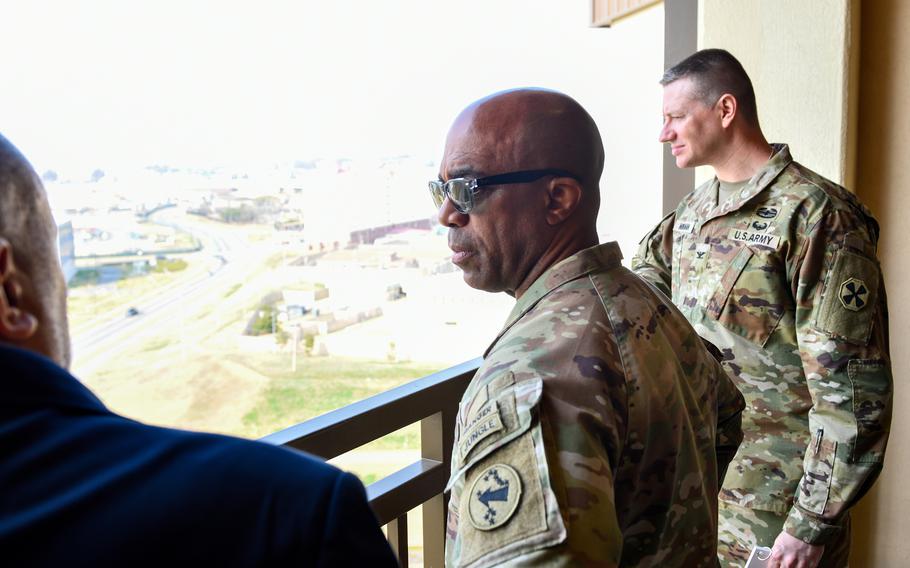 A U.S. general looks out at Camp Humphreys during a tour.