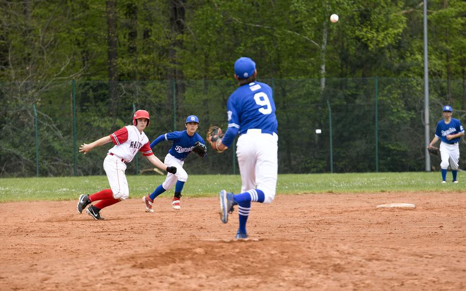 Ramstein's Liam Delp attempts to pick off Kaiserslautern's Sawyer Ter Horst as his teammate Keegan Cornelius races to cover second base in a game Saturday, April 30, 2022, in Kaiserslautern, Germany.