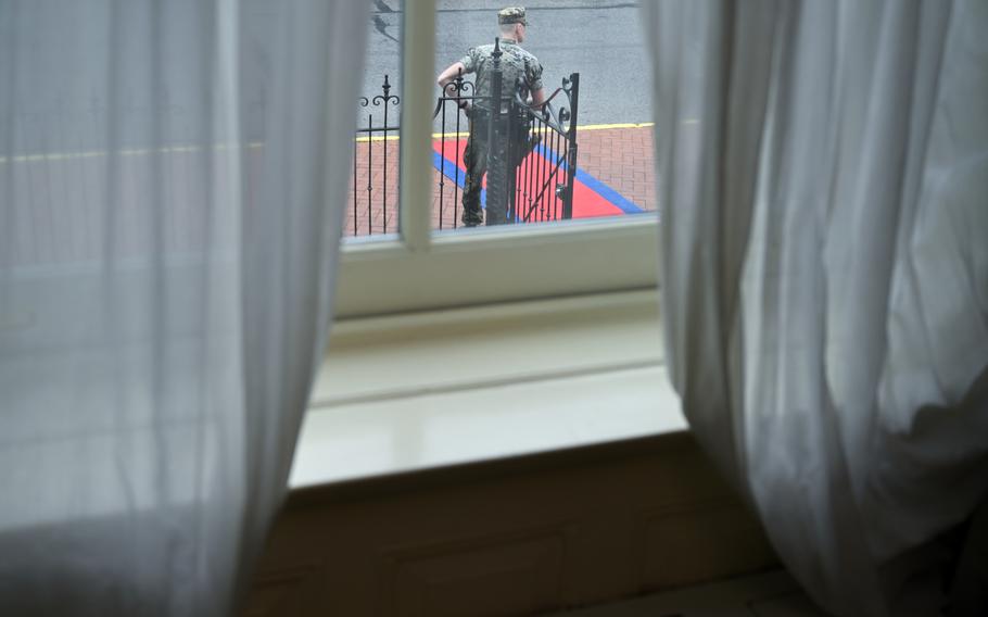 A Marine stands outside the residence of Gen. Eric M. Smith before a ceremony in which he recognized Timothy LaLonde, his sister Joyce LaLonde and her husband Nathaniel Birnbaum on Thursday. MUST CREDIT: Matt McClain/The Washington Post