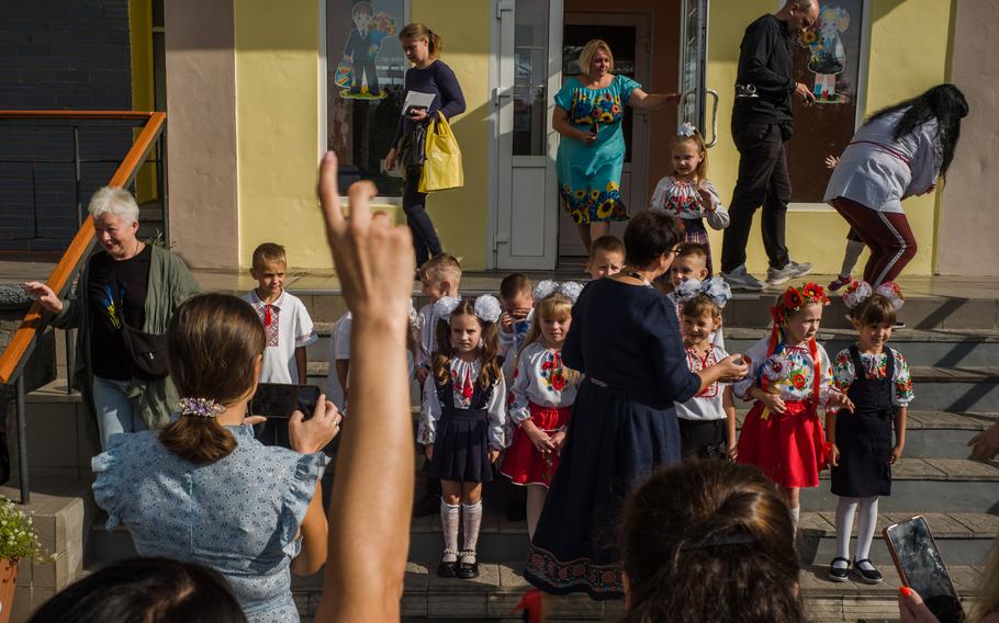 First-grade students in Nove Zalissya, Ukraine, get ready for a class photo on the first day of school. 