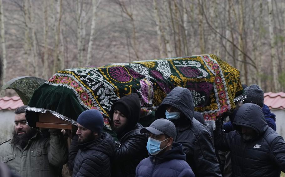 A local Muslim community buried a Yemeni migrant, Mustafa Mohammed Murshed Al-Raimi, in Bohoniki, Poland, Sunday, Nov. 21, 2021. The person is one of about a dozen people from the Middle East and elsewhere who have died in an area of forests and bogs along the Poland-Belarus border amid a standoff involving migrants between the two countries.