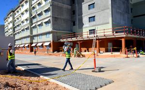 Guam contractors work on a portion of one of Marine Corps Base Camp Blaz's bachelor enlisted quarters on Dec. 10, 2024.