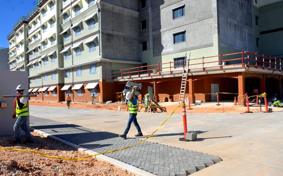Guam contractors work on a portion of one of Marine Corps Base Camp Blaz's bachelor enlisted quarters on Dec. 10, 2024.