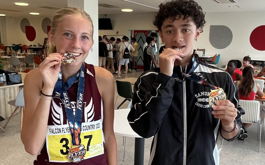 Race winners Jane Williams and Tyler Gaines of Matthew C. Perry display their medals following Saturday's Canadian Academy Falcon Flyer cross country meet in Kobe.