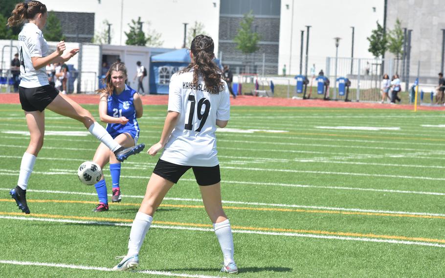Ramstein's Olivia Davis tries to get a shot past Kaiserslautern defenders Ryann Phillips, left, and Audrey Patterson on Monday, May 20, 2024, at the DODEA European Division I girls soccer championships at Ramstein High School.