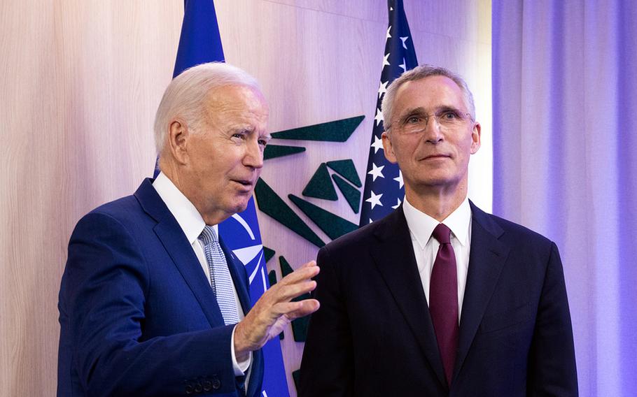 U.S. President Joe Biden, left, speaks July 11, 2023, before the start of the NATO summit in Vilnius, Lithuania, flanked by NATO Secretary-General Jens Stoltenberg.