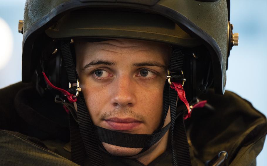 Sgt. David Sigdestad, an explosive ordnance disposal technician with Marine Wing Support Squadron 171, shows off an 85-pound bomb suit at Marine Corps Air Station Iwakuni, Japan, Friday, July 9, 2021. 