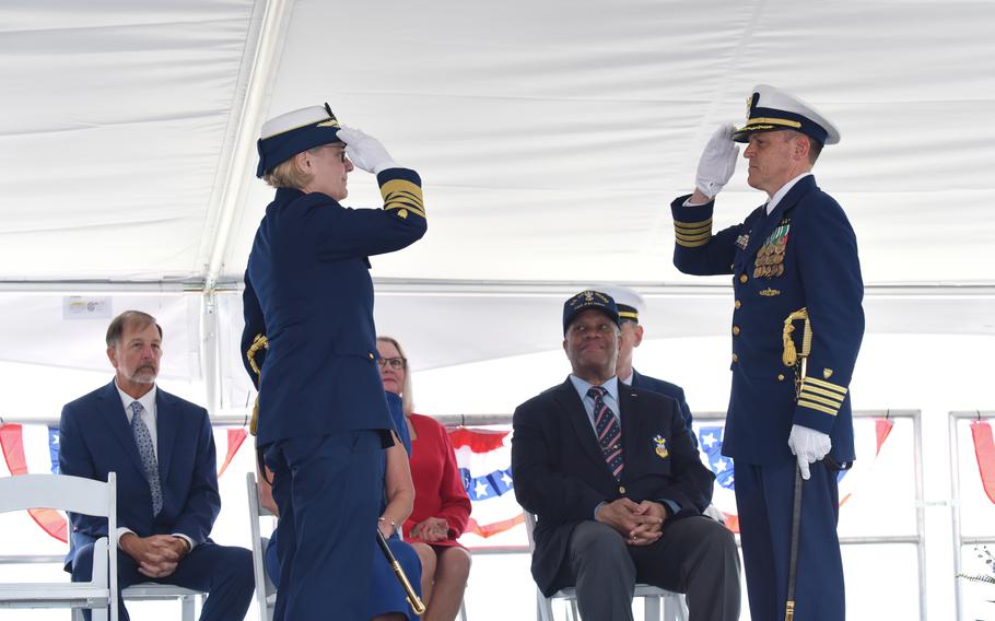 Coast Guard Commandant Adm. Linda Fagan and Capt. Timothy Sommella, commanding officer of U.S. Coast Guard Cutter Calhoun (WMSL 759), salute each other during the cutter’s commissioning ceremony, Saturday, April 20, 2024, in North Charleston, S.C. 