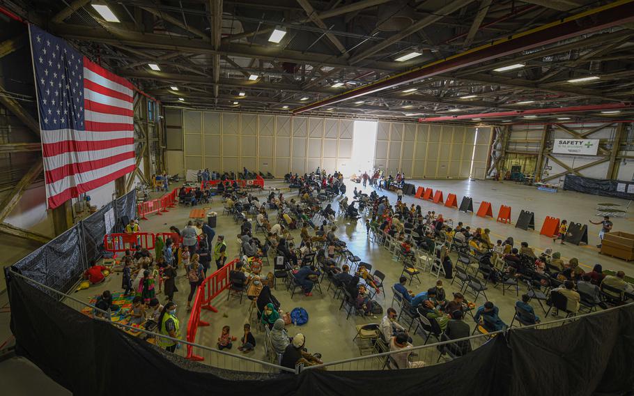 Evacuees from Afghanistan wait to board a flight bound for the United States from Naval Air Station Sigonella, Italy, Aug. 28, 2021. 