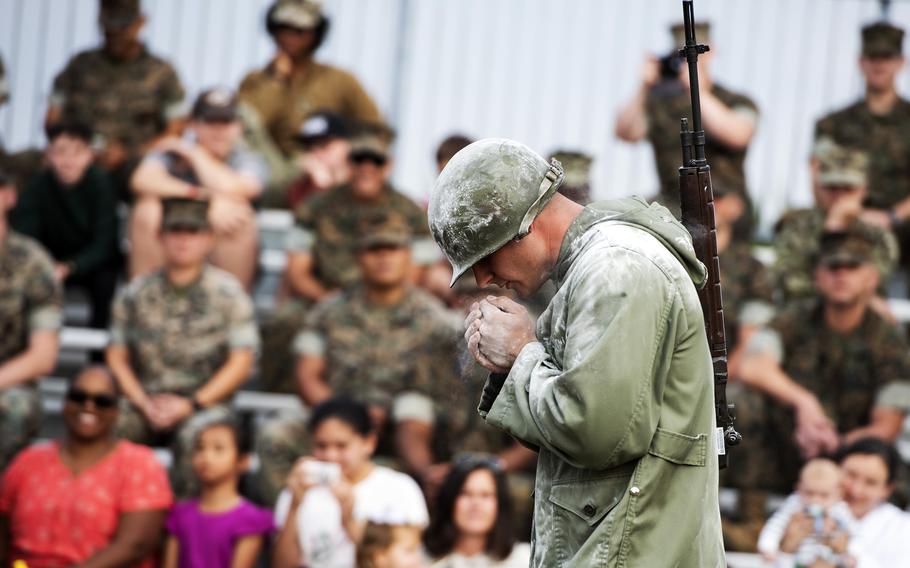 A Marine wears a Korean War-era uniform during an event to mark the Marine Corps’ 246th birthday at Marine Corps Air Station Iwakuni, Japan, Tuesday, Nov. 2, 2021.