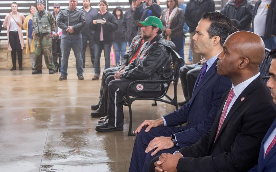 George P. Bush, commissioner of the Texas General Land Office, left, and retired Air Force Mater Sgt. Eric Brown, former deputy director of Texas State Veterans Cemeteries, attend the burial of an unaccompanied veteran in 2019 at the Central Texas State Veterans Cemetery in Killeen, Texas.