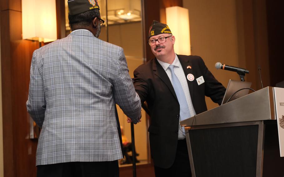 Patrick Murray, the VFW’s national legislative director, greets a fellow Veterans of Foreign Wars member Monday, March 4, 2024, at the group’s conference in Crystal City, Va. 