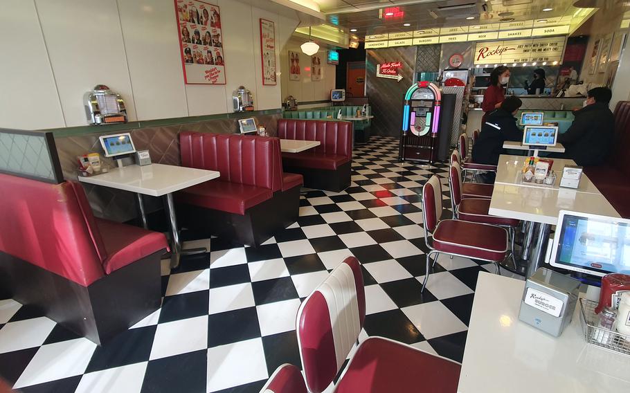 The stage is set for a 1950s sitcom at Rocky's Burger in Pyeongtaek, South Korea.