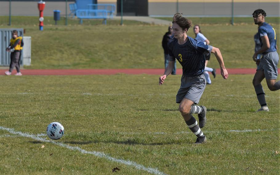 Ansbach’s Alexander Pohlman runs on to a ball just past half field at Ansbach on Saturday, March 18, 2023. Ansbach opened its season with a home win taking down the Baumholder Buccaneers 7-0. 