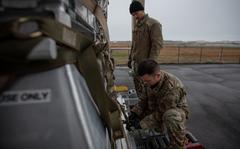 U.S. Air Force Staff Sergeant Rafael DeGuzman-Paniagua, 305th Aerial Port Squadron special handling representative, and Senior Airman Mario Rentero-Ruiz, 305th APS special handling specialist, secure a pallet of equipment on Joint Base McGuire-Dix-Lakehurst, N.J., Mar. 24, 2022. The 305th Air Mobility Wing is sending equipment to Europe as part of the United States security assistance to Ukraine. The United States supports Ukraine’s sovereignty and territorial integrity. (U.S. Air Force photo by Senior Airman Joseph Morales)