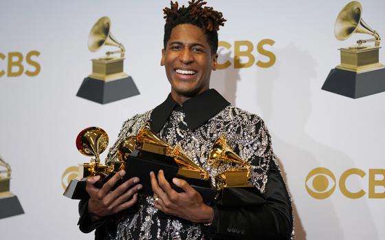 Jon Batiste, winner of the awards for best American roots performance for "Cry," best American roots song for "Cry," best music video for "Freedom," best score soundtrack for visual media for "Soul," and album of the year for "We Are," poses in the press room at the 64th Annual Grammy Awards at the MGM Grand Garden Arena on Sunday, April 3, 2022, in Las Vegas. 
