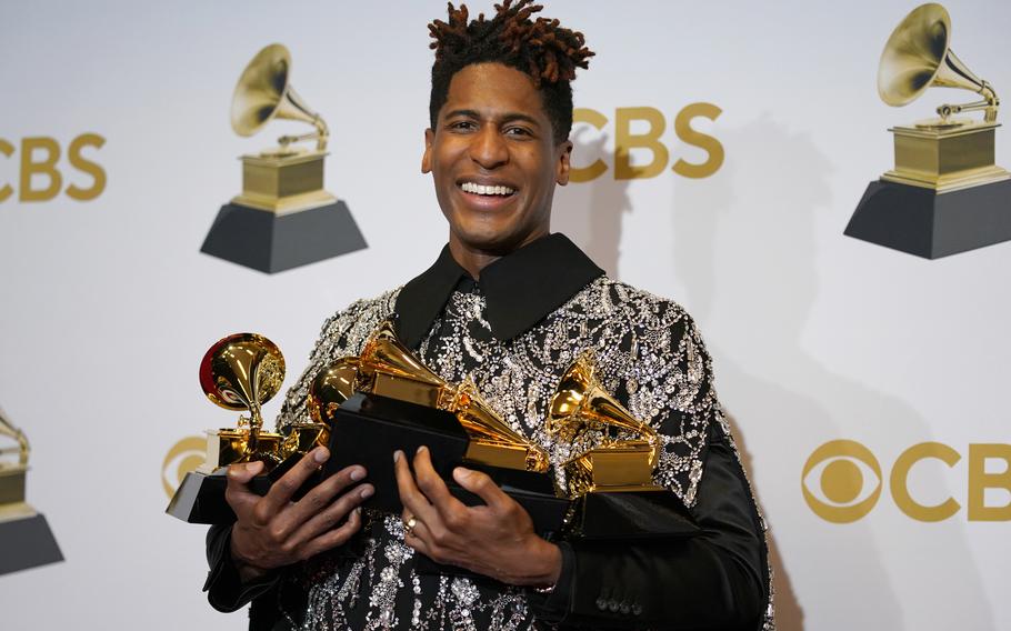 Jon Batiste, winner of the awards for best American roots performance for “Cry,” best American roots song for “Cry,” best music video for “Freedom,” best score soundtrack for visual media for “Soul” and album of the year for “We Are,” poses in the press room at the 64th Annual Grammy Awards at the MGM Grand Garden Arena on Sunday, April 3, 2022, in Las Vegas. 